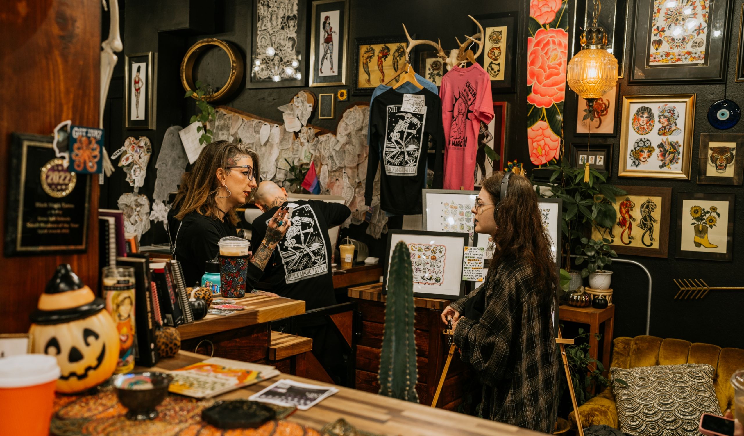 Image inside Black Magic Tattoo shop of an artist and client talking