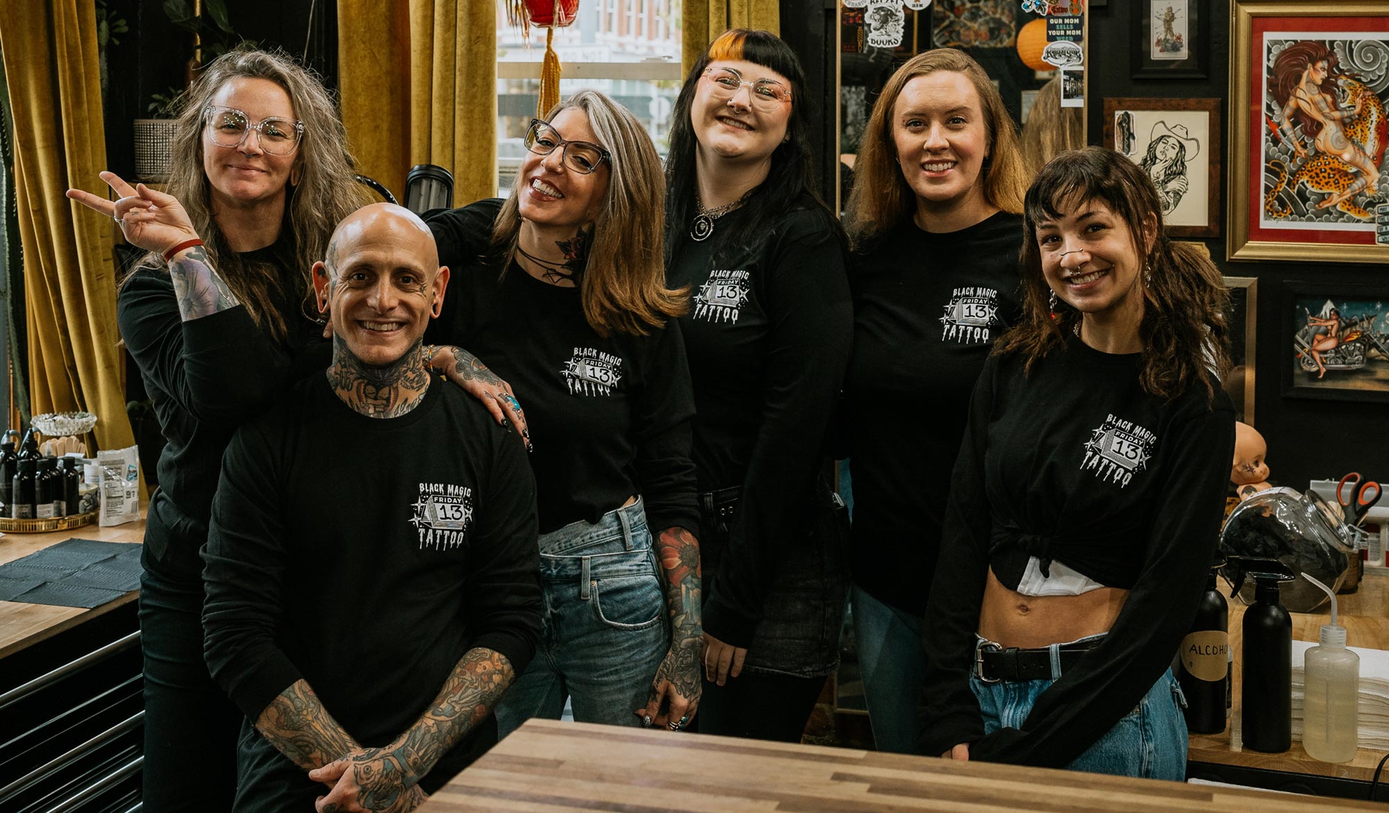 The Black Magic Tattoo crew in black Friday the 13th t-shirts.